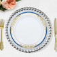 White plastic dinner plate with royal blue rim and gold vine design.