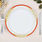White dinner plate with red rim and gold vine design.