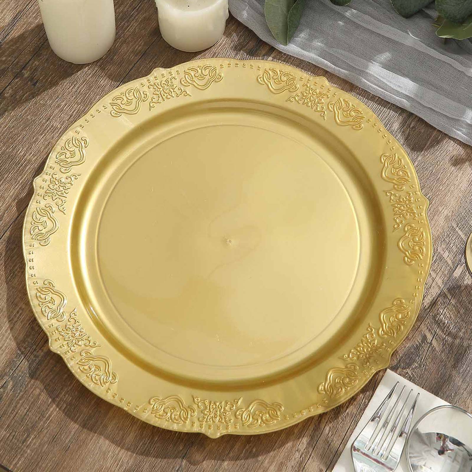 Gold embossed round dinner plate with scalloped edges.