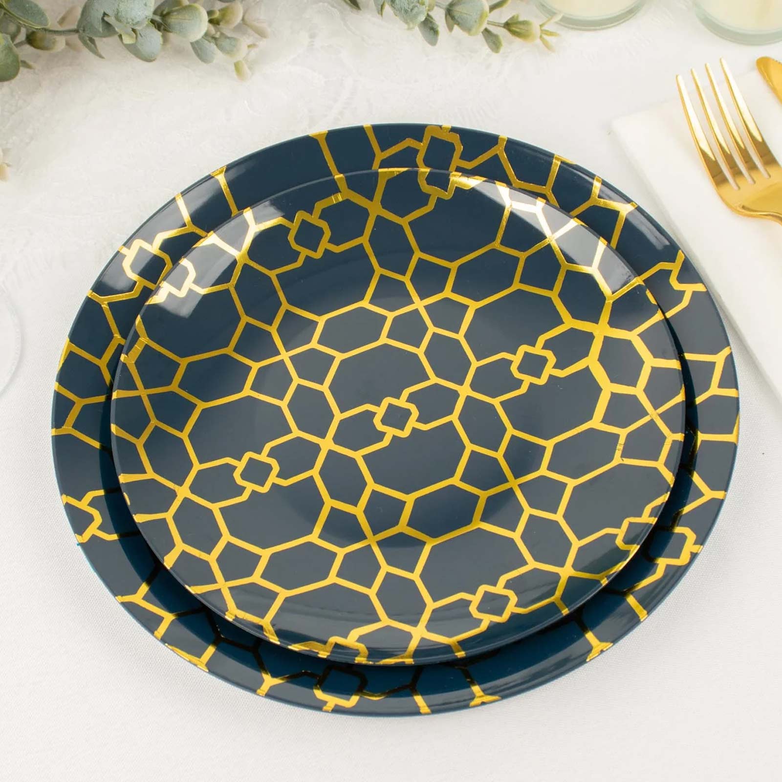 Navy blue geometric gold print disposable plates set for parties.