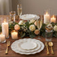Pearl white ruffled rim dessert plates with gold edging on a table setting.