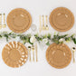Gold disposable dinner plates with ruffled rim on a table setting.