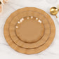 Gold heavy duty disposable dinner plates with ruffled rim.