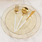 Gold glitter plastic dinner plate with ruffled rim and gold utensils.