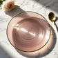 Dusty rose swirl plastic dinner plate with gold rim, elegant design for parties.