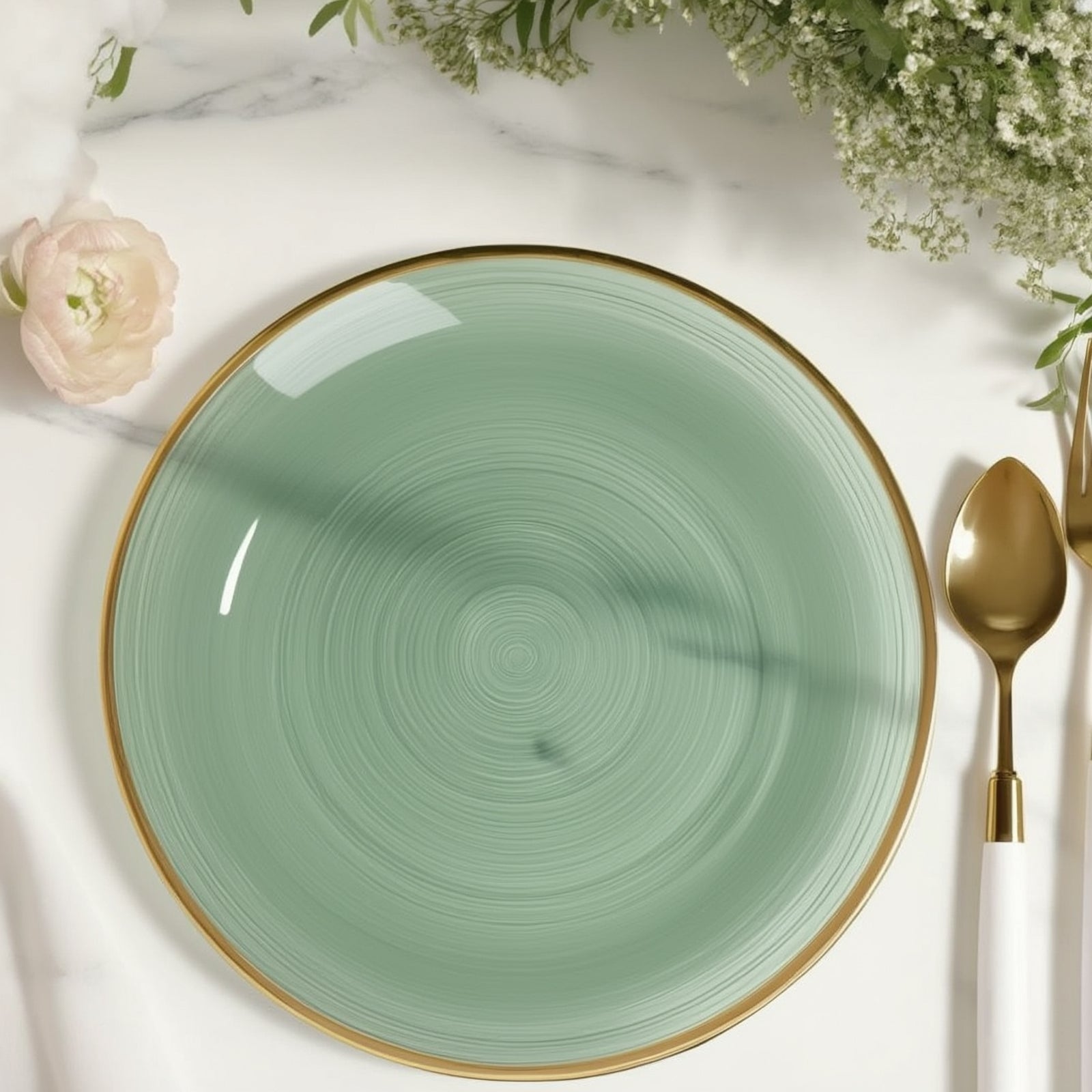 Round transparent dusty sage green swirl plate with gold rim.
