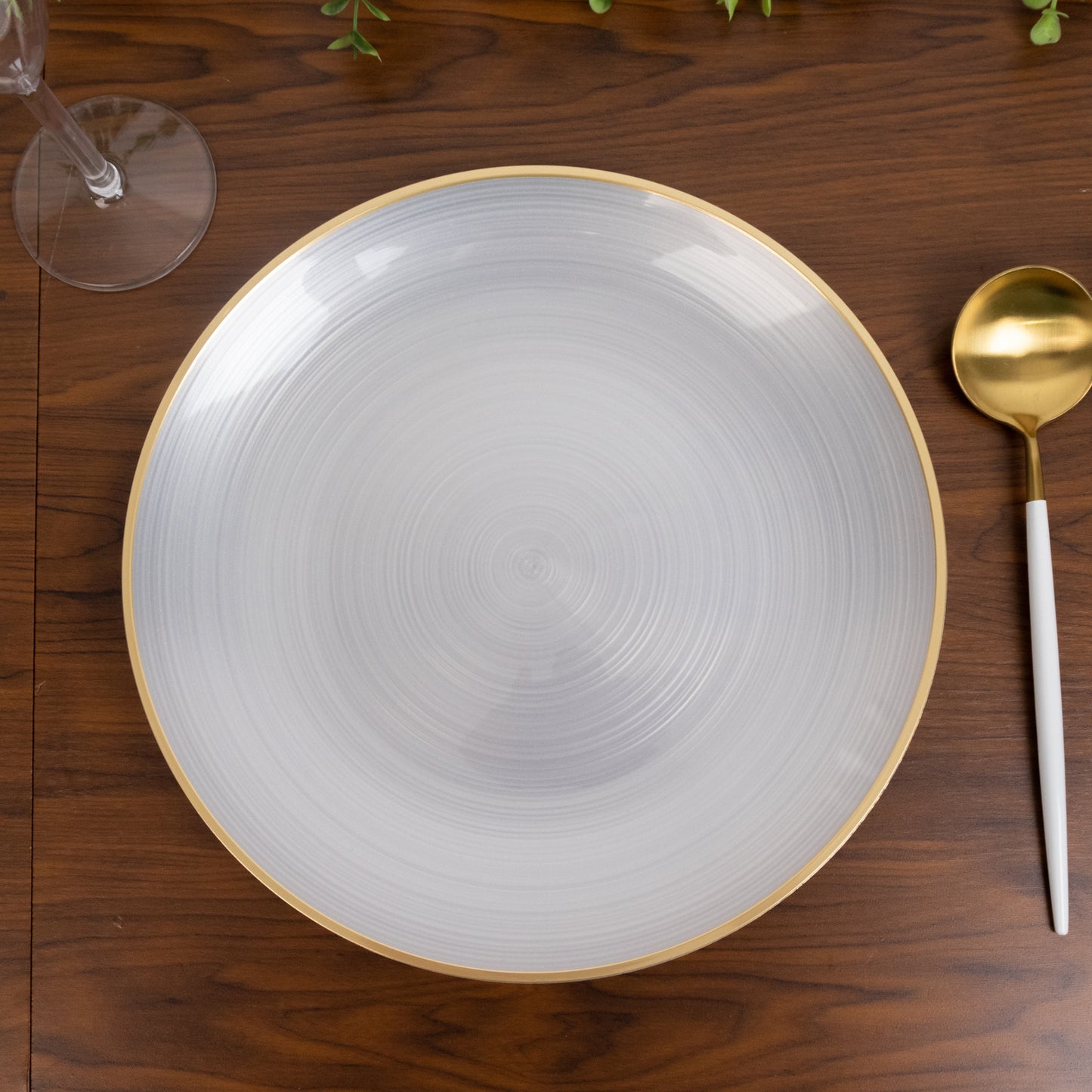 Transparent pearl white swirl plate with gold rim. Elegant dinnerware for parties.