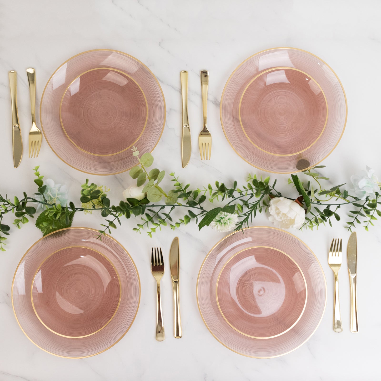 Dusty rose swirl plates with gold rim, elegant for parties.