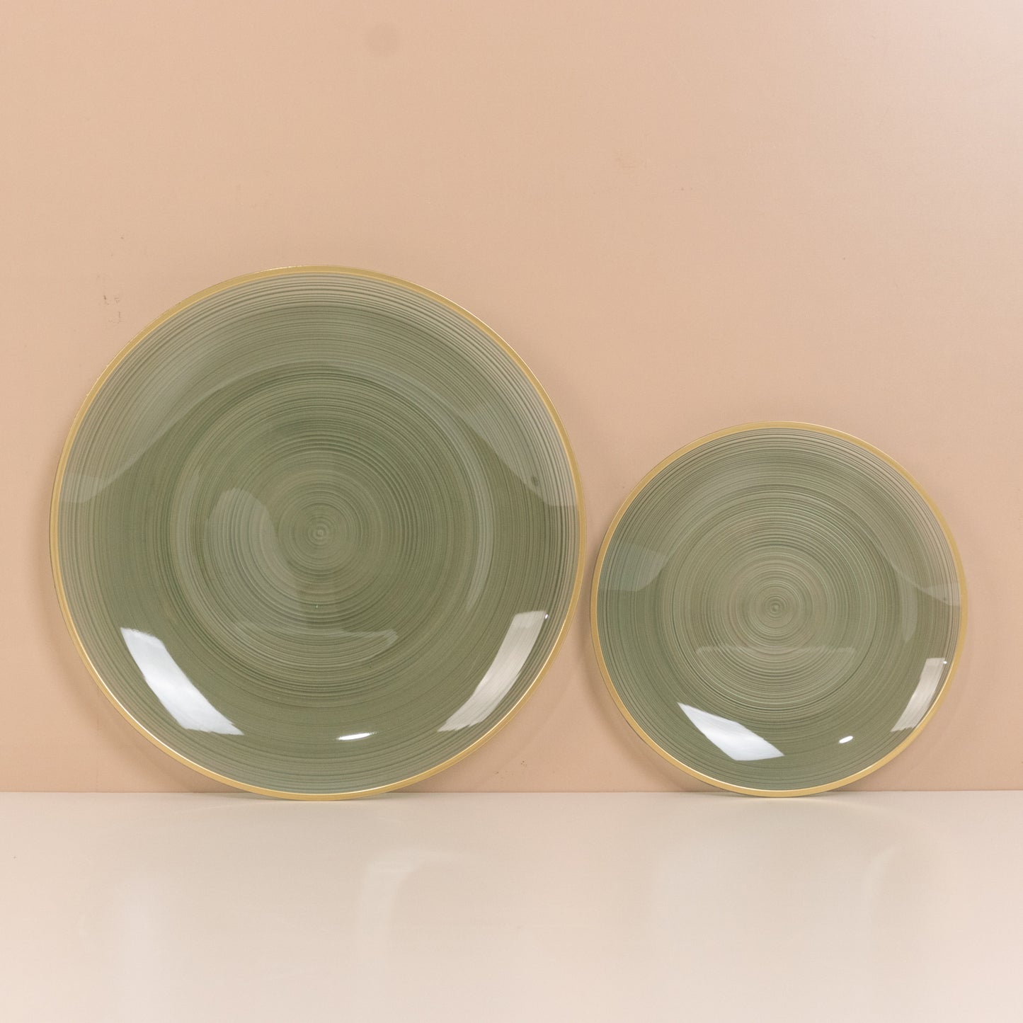 Dusty sage green swirl plates with gold rim, elegant for parties.