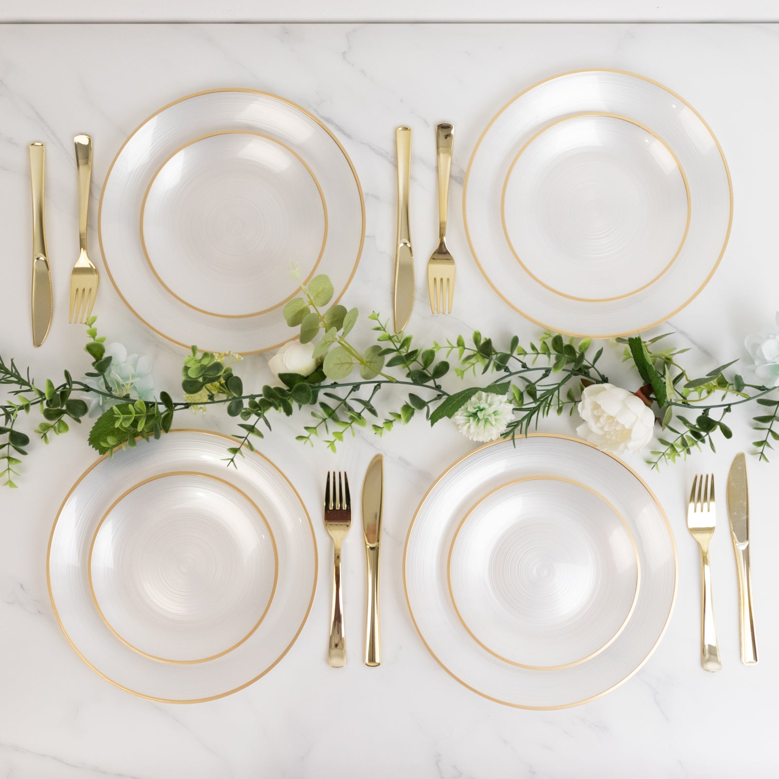 20-Pack 7" transparent pearl white swirl plates with gold rim for elegant parties.