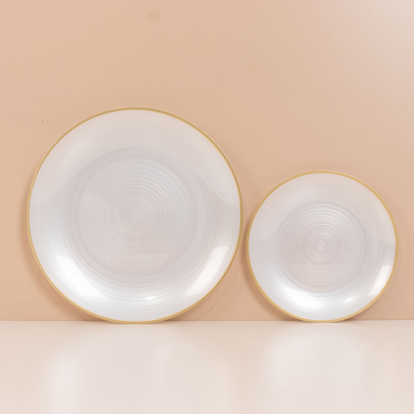 Transparent pearl white swirl plates with gold rim – elegant party dinnerware.