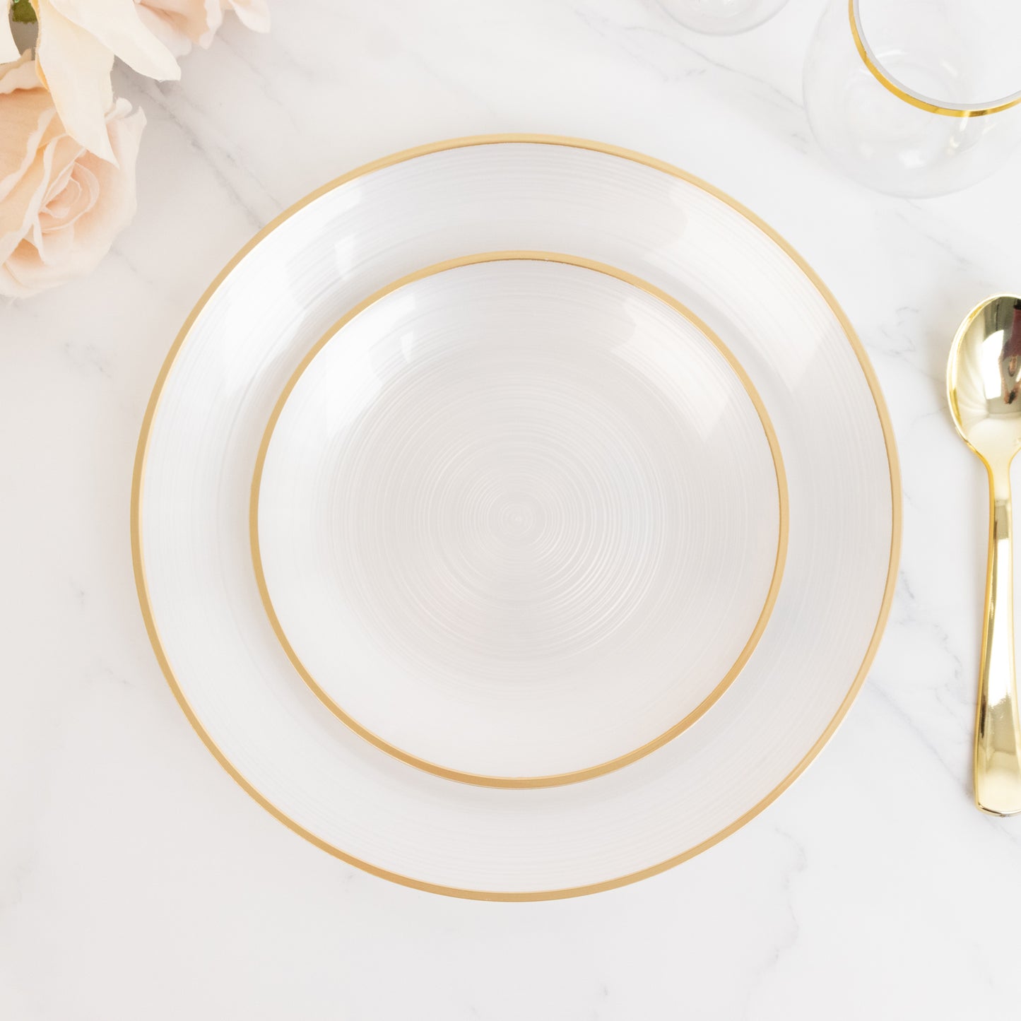Transparent pearl white swirl plate with gold rim for elegant dining.