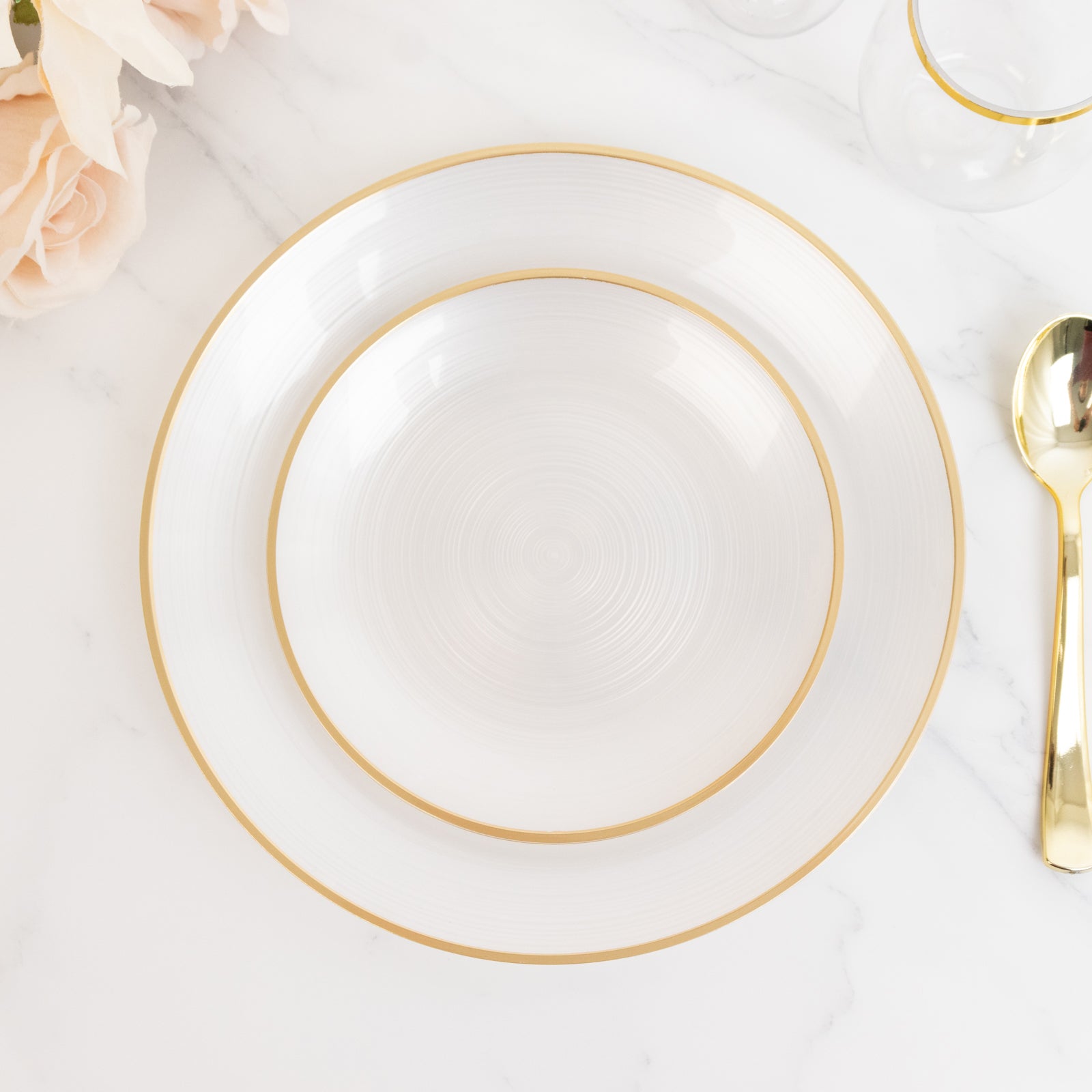 Transparent pearl white swirl plate with gold rim for elegant dining.