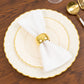 Ivory and gold flair rim disposable dessert plates on a wooden table.