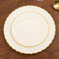 Ivory and gold flair rim disposable dessert plates on a wooden table.