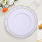 Elegant white plate with gold trim on a decorative table setting.