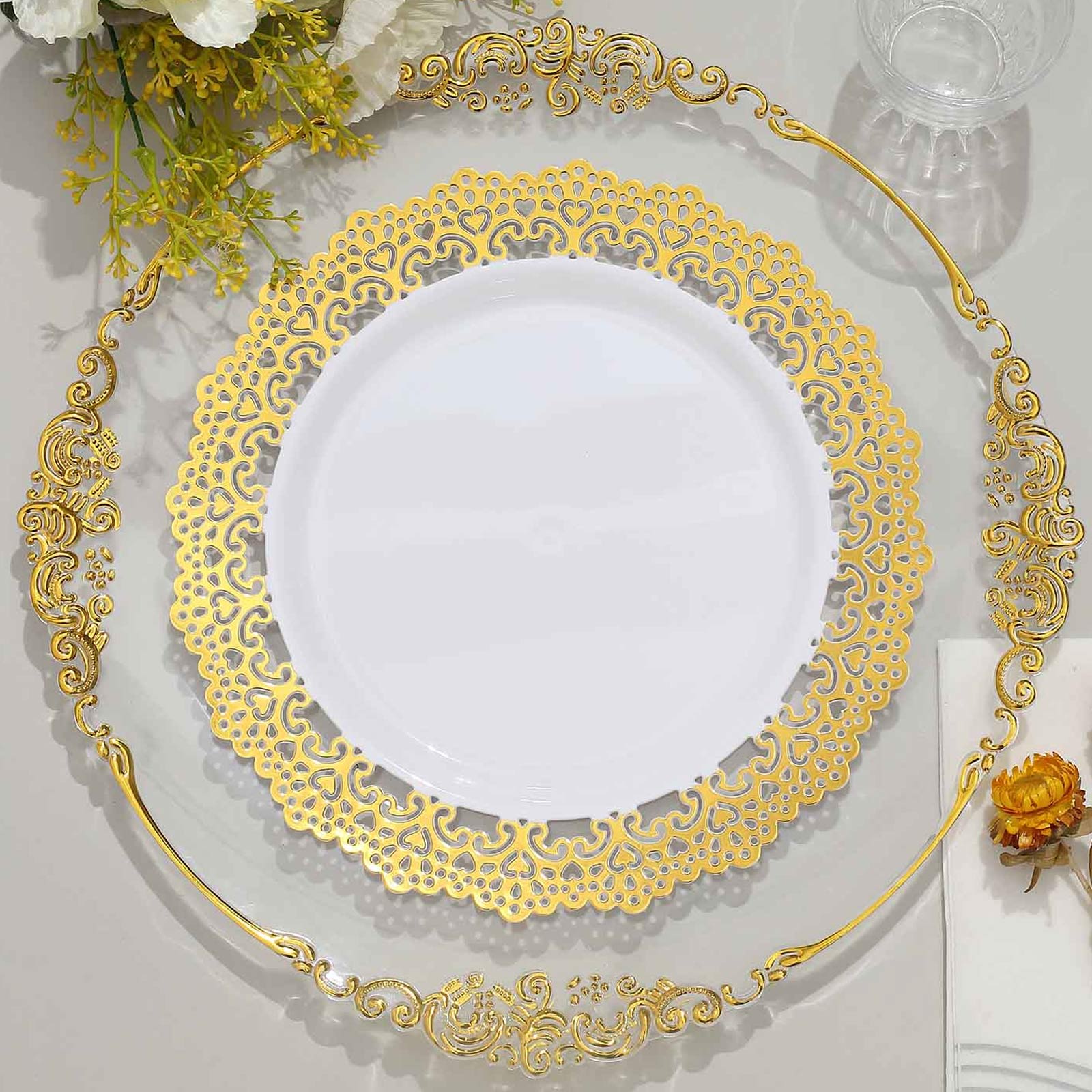 White plastic dinner plates with gold lace rim, perfect for parties.