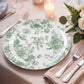 Sage green and white floral disposable dinner plate on a table setting.