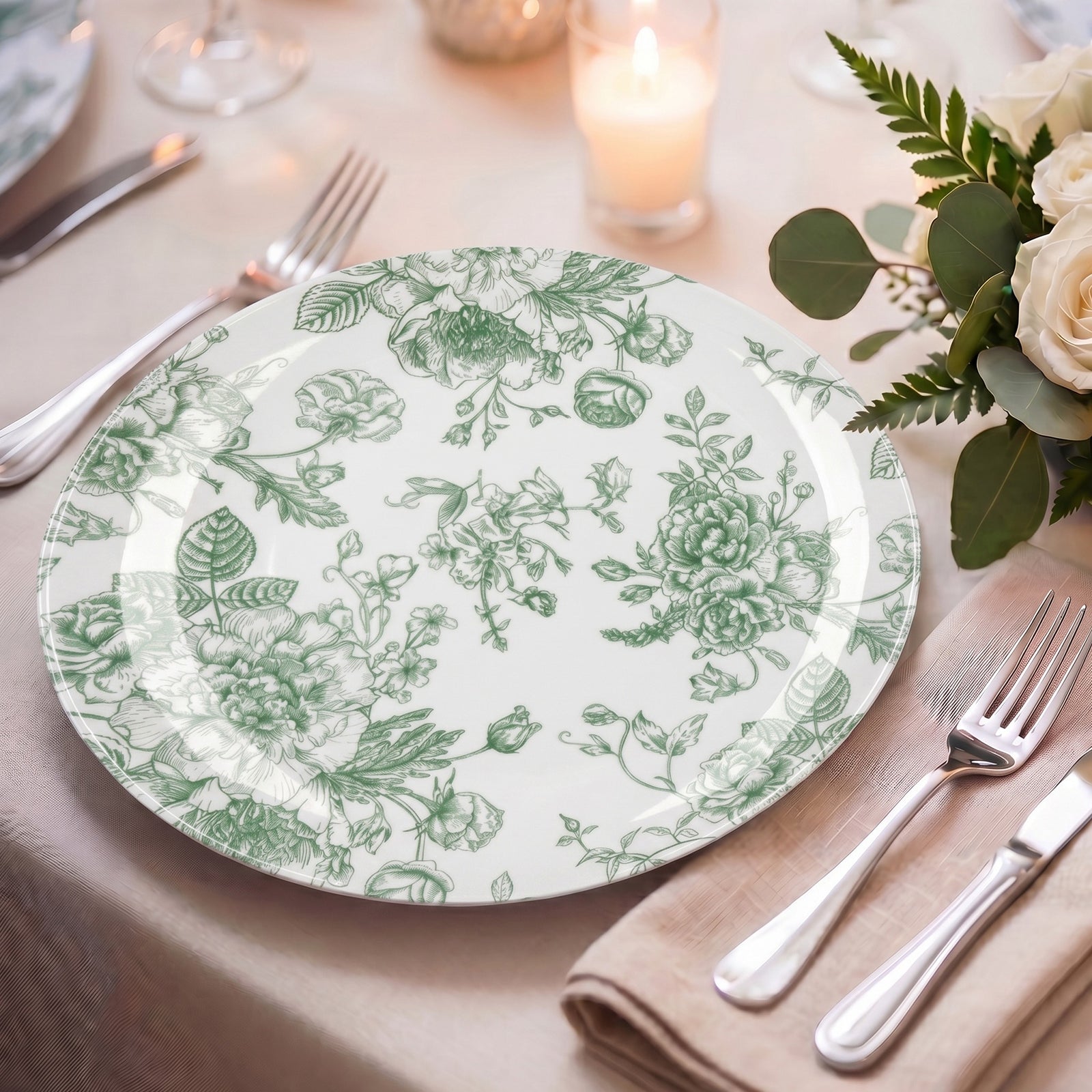 Sage green and white floral disposable dinner plate on a table setting.