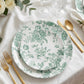 Sage green and white floral disposable salad plates on a table setting.