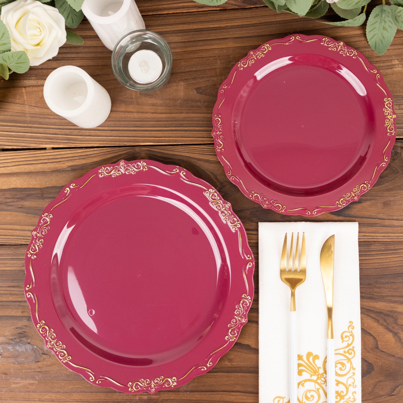 Burgundy disposable dinner plates with embossed scalloped edges.