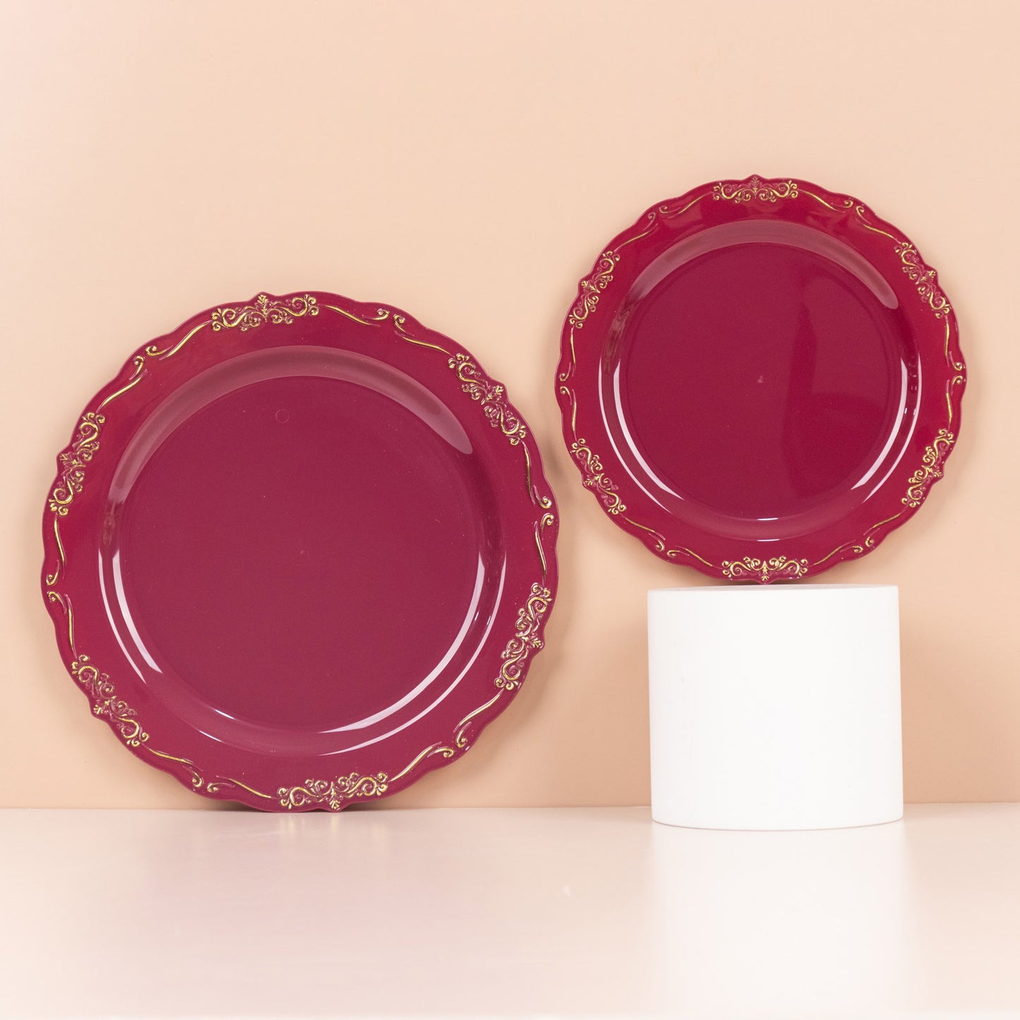 Burgundy disposable dinner plates with gold vintage rim and embossed edges.