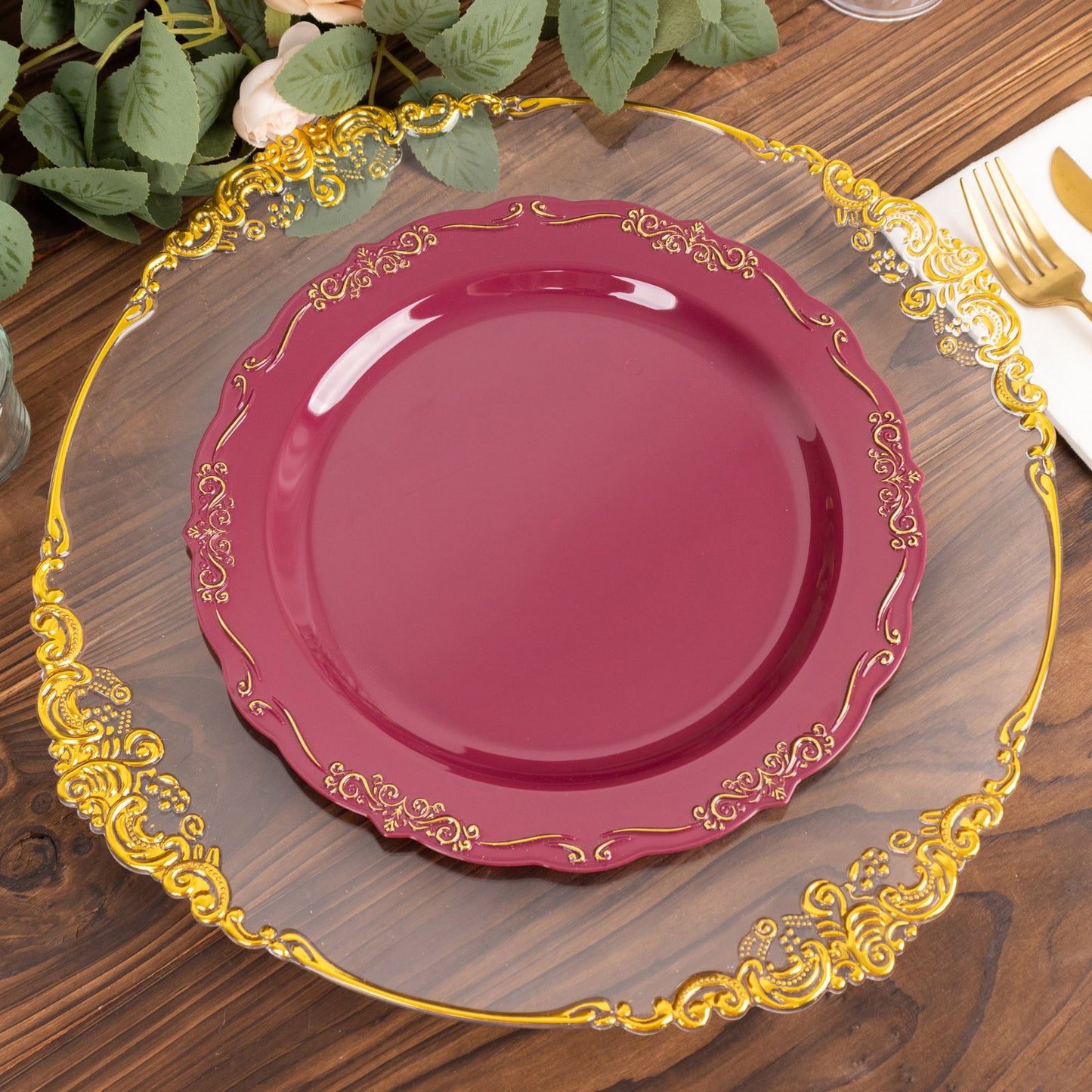 Burgundy disposable dinner plate with gold vintage rim and embossed edges.