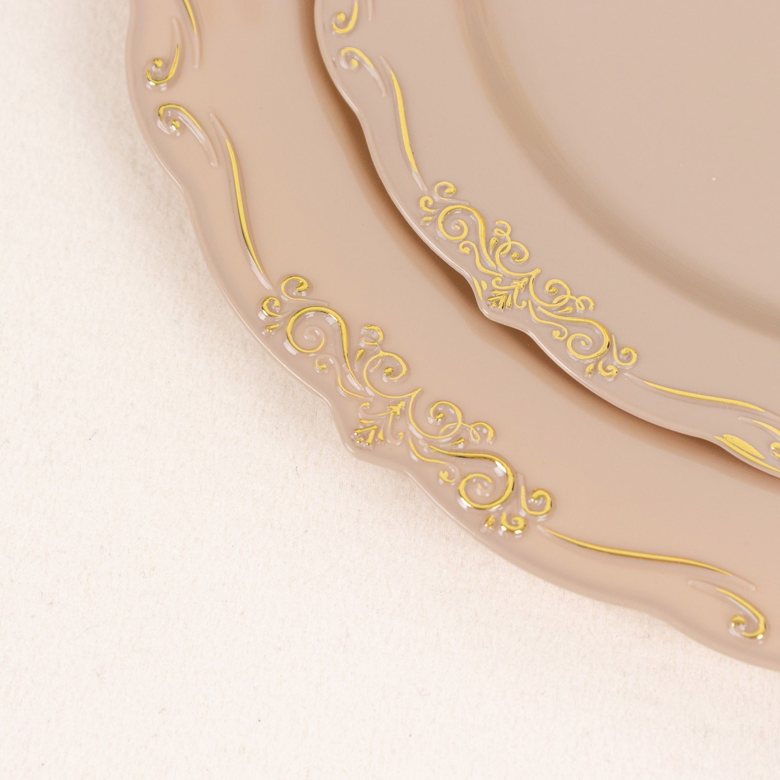 Taupe disposable dinner plates with gold vintage rim and scalloped edges.