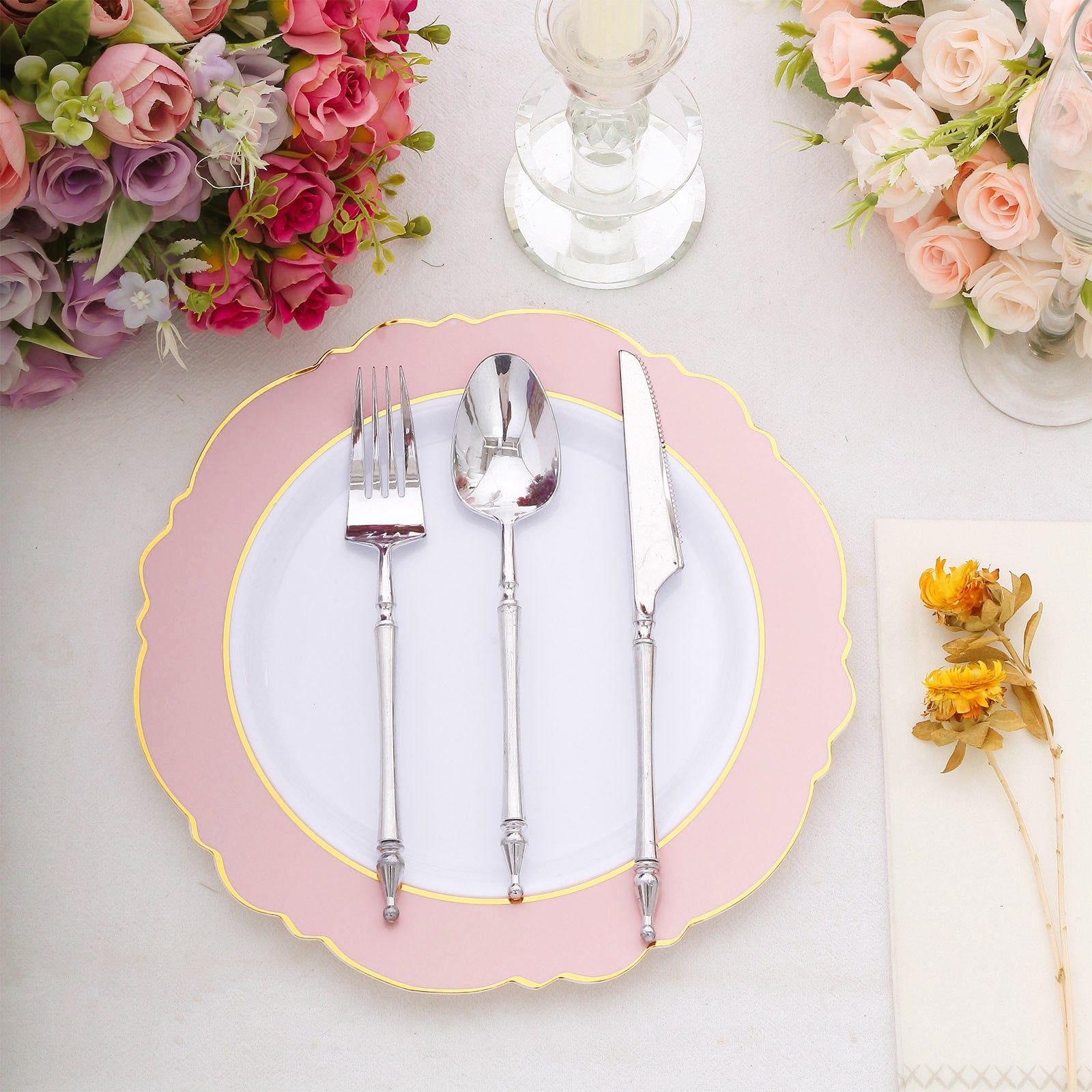 Blush white disposable dinner plate with gold rim and blossom design.