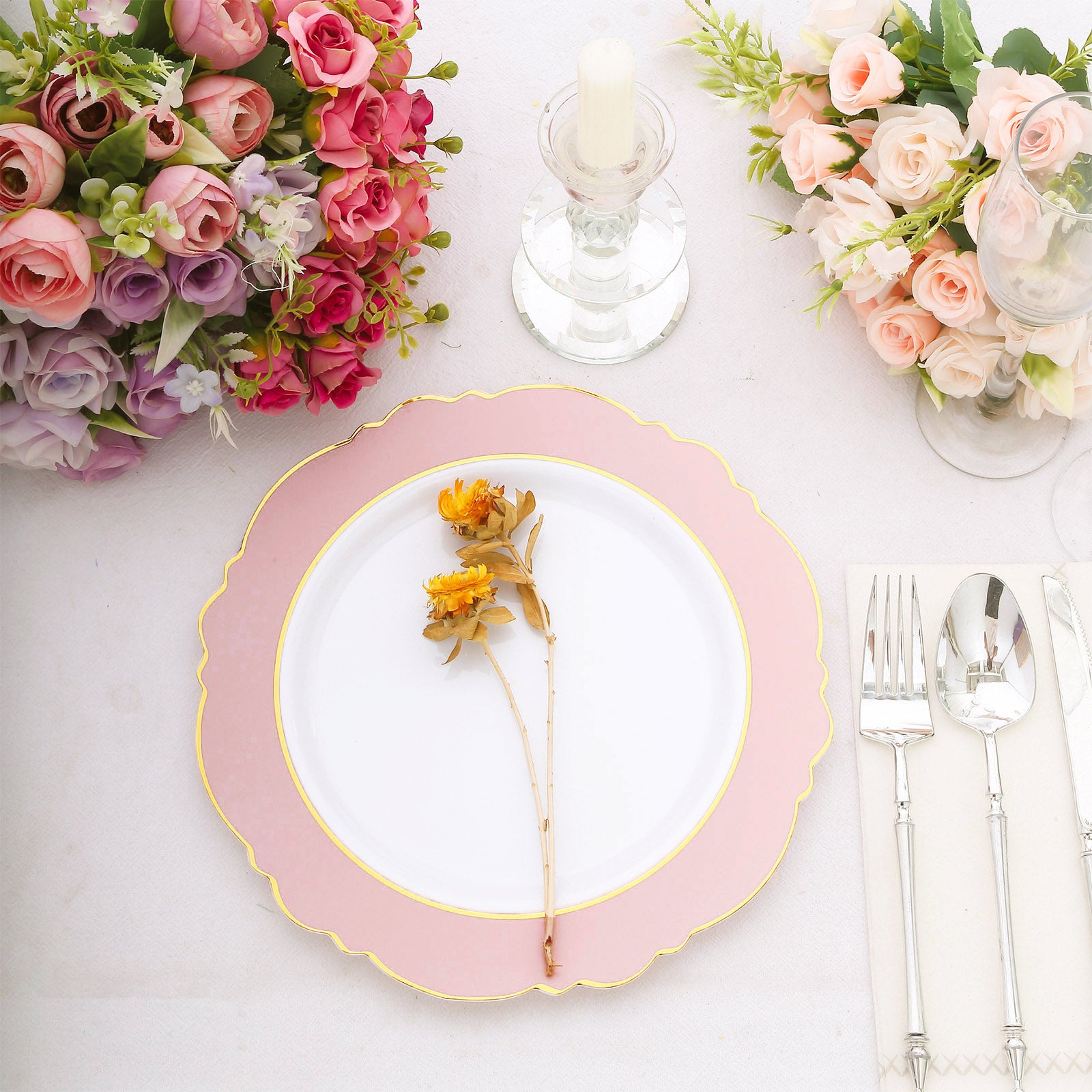 Blush white disposable dinner plate with gold rim and floral decoration.