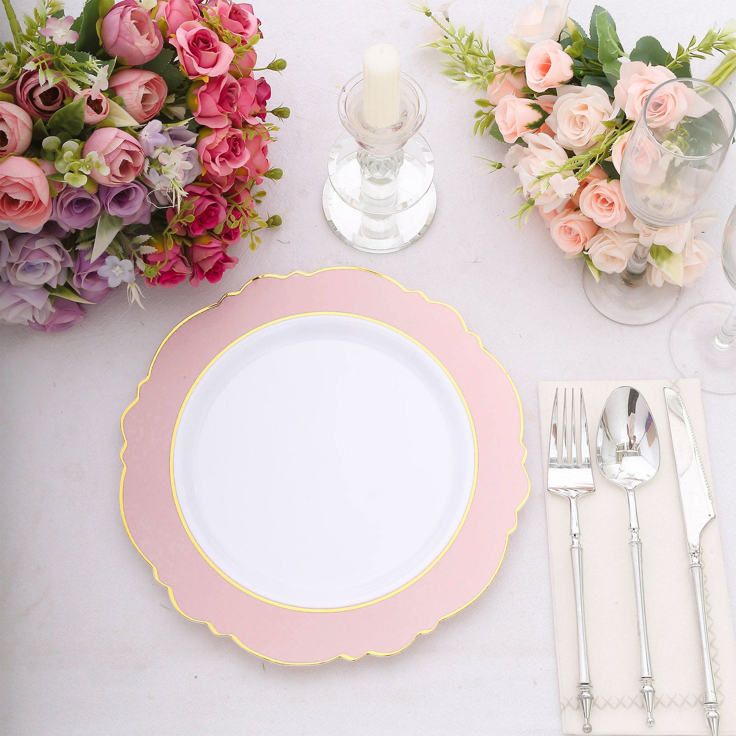 Blush white disposable dinner plate with gold rim and round blossom design.