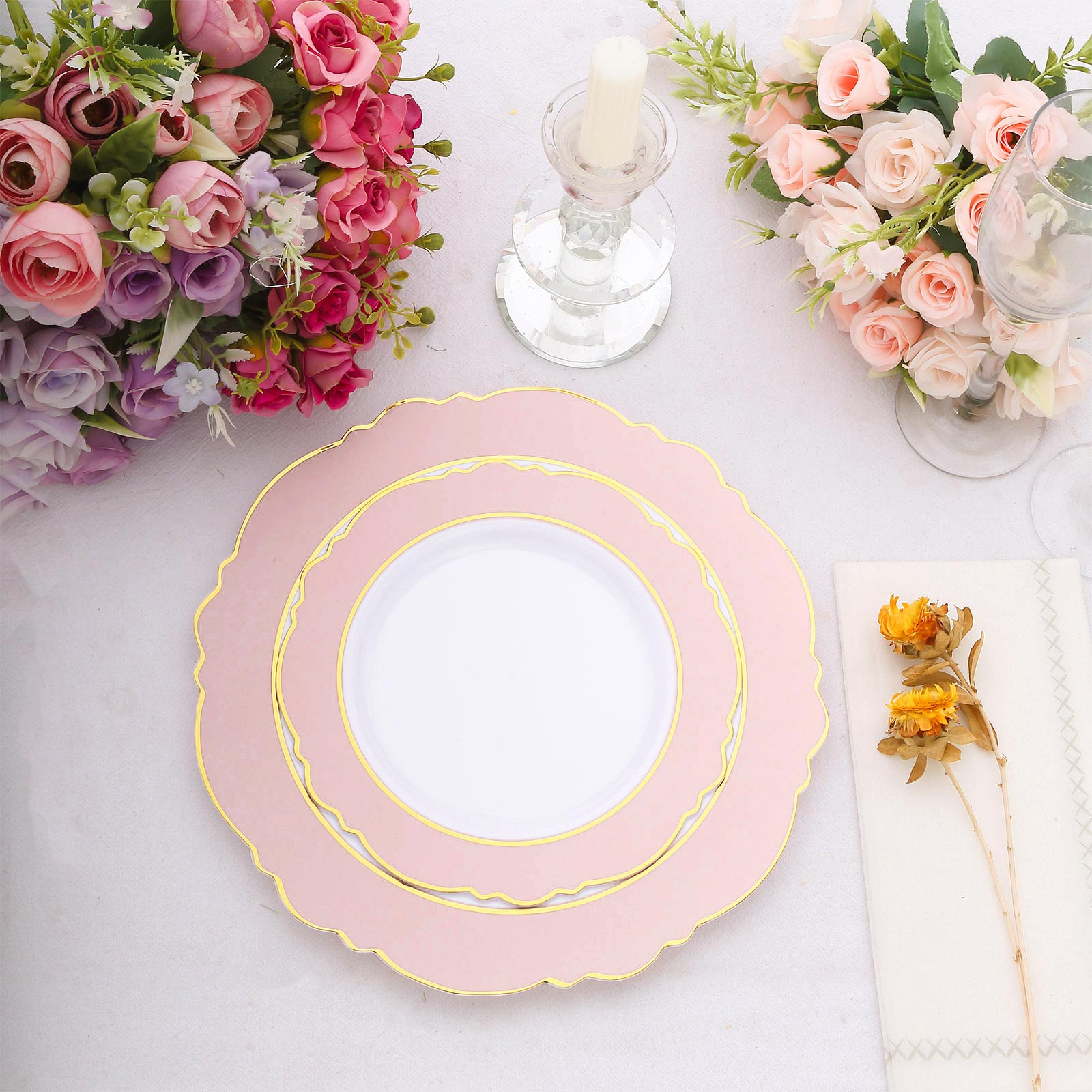 Blush white disposable salad plates with gold rim and round blossom design.