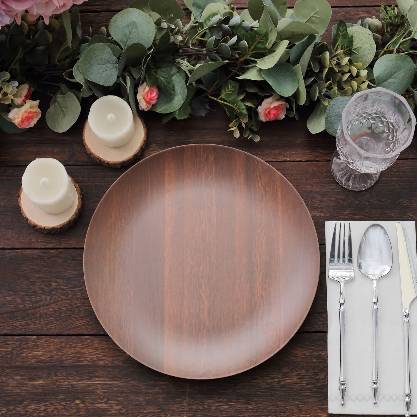 Rustic brown round melamine dinner plate on a wooden table setting.