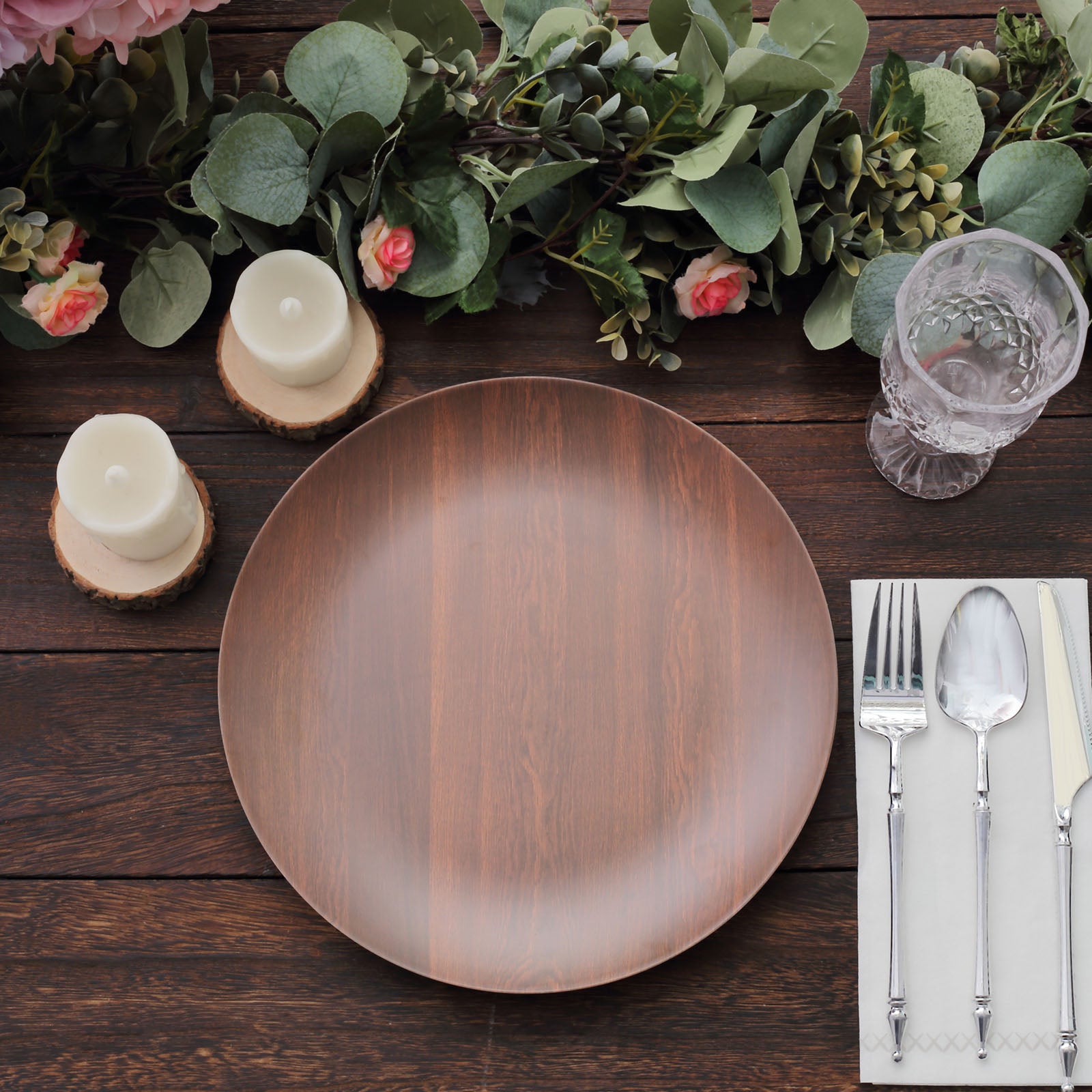 Rustic brown round melamine dinner plate on a wooden table setting.
