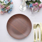 Rustic brown wood grain shatterproof melamine dinner plate on a table setting.