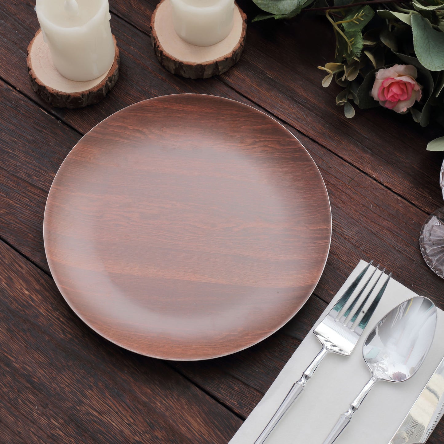 Rustic brown melamine salad plate with wood grain design on a rustic table setting.