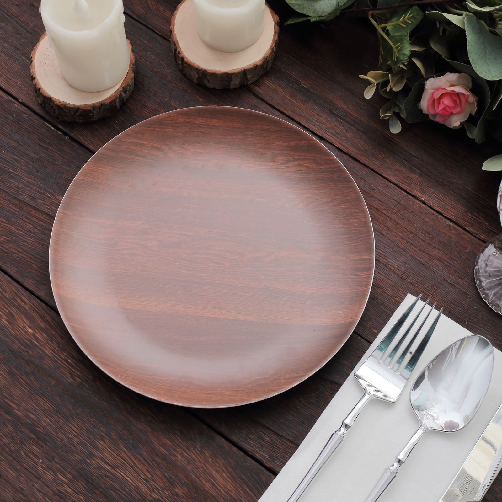 Rustic brown melamine salad plate with wood grain design on a rustic table setting.