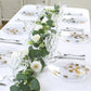 Clear gold butterfly plastic party plates with gold rim on a table setting.