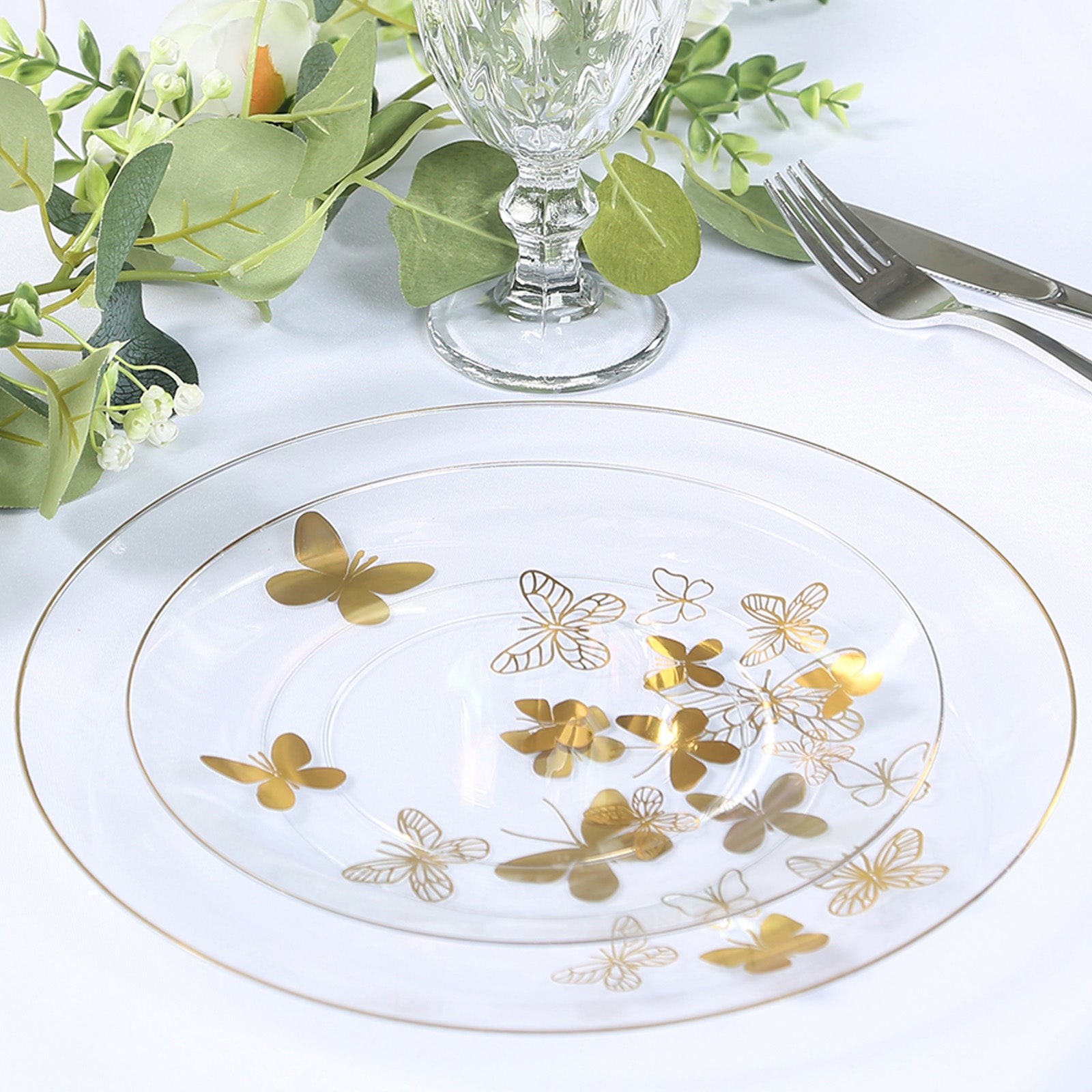 Clear gold butterfly plastic party plates with gold rim, round disposable design.