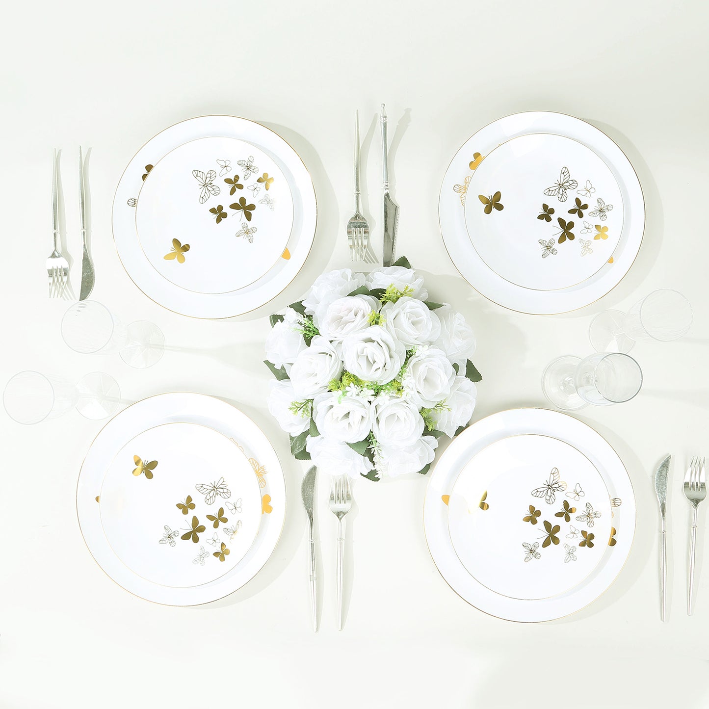 White gold butterfly plastic party plates with gold rim.