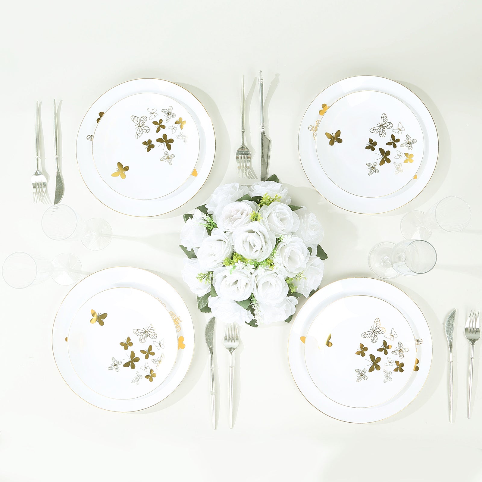 White gold butterfly plastic party plates with gold rim.