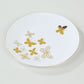 White gold butterfly plastic party plate with gold rim.
