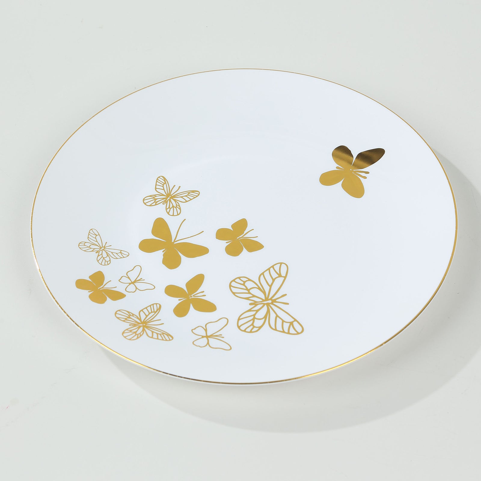 White gold butterfly plastic party plate with gold rim.