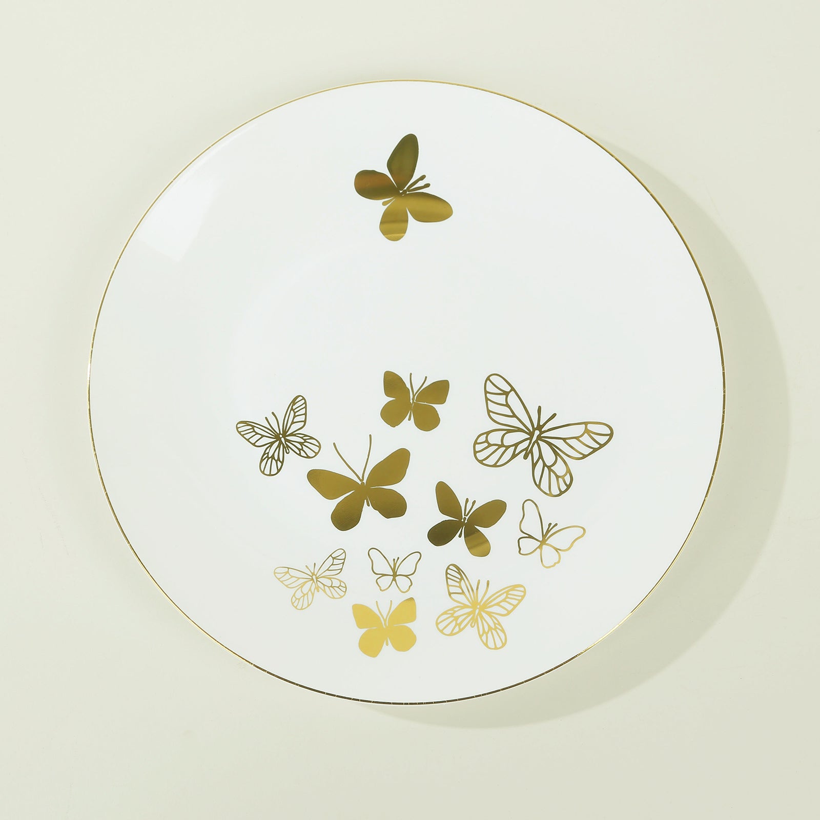 White gold butterfly disposable plate with gold rim, round design.