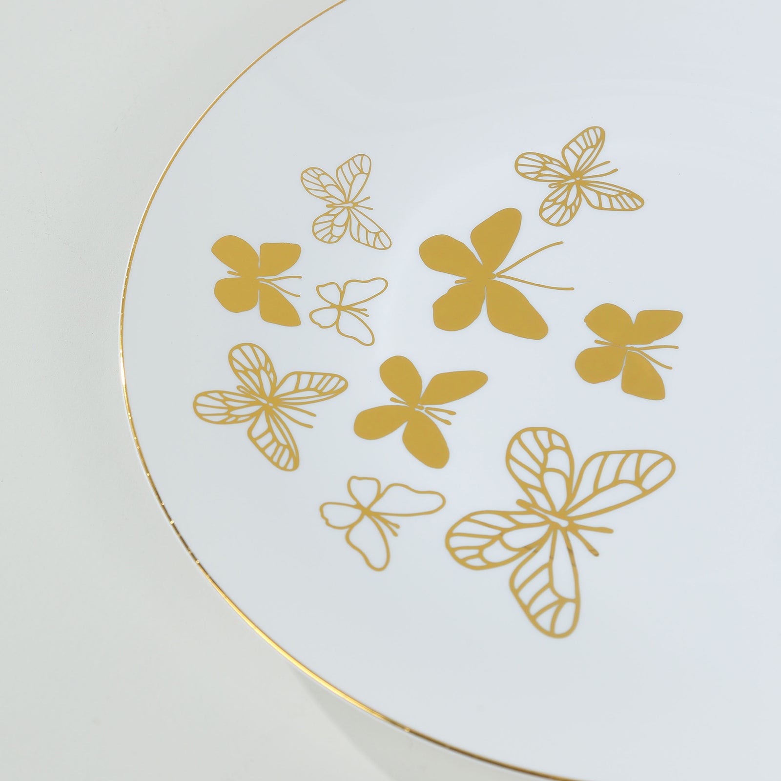 White gold butterfly disposable plates with gold rim, 10" and 8" sizes.