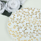 White round plastic dessert plate with gold leaf design.