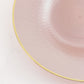 Blush round plastic dinner plate with gold rim and diamond-cut pattern.
