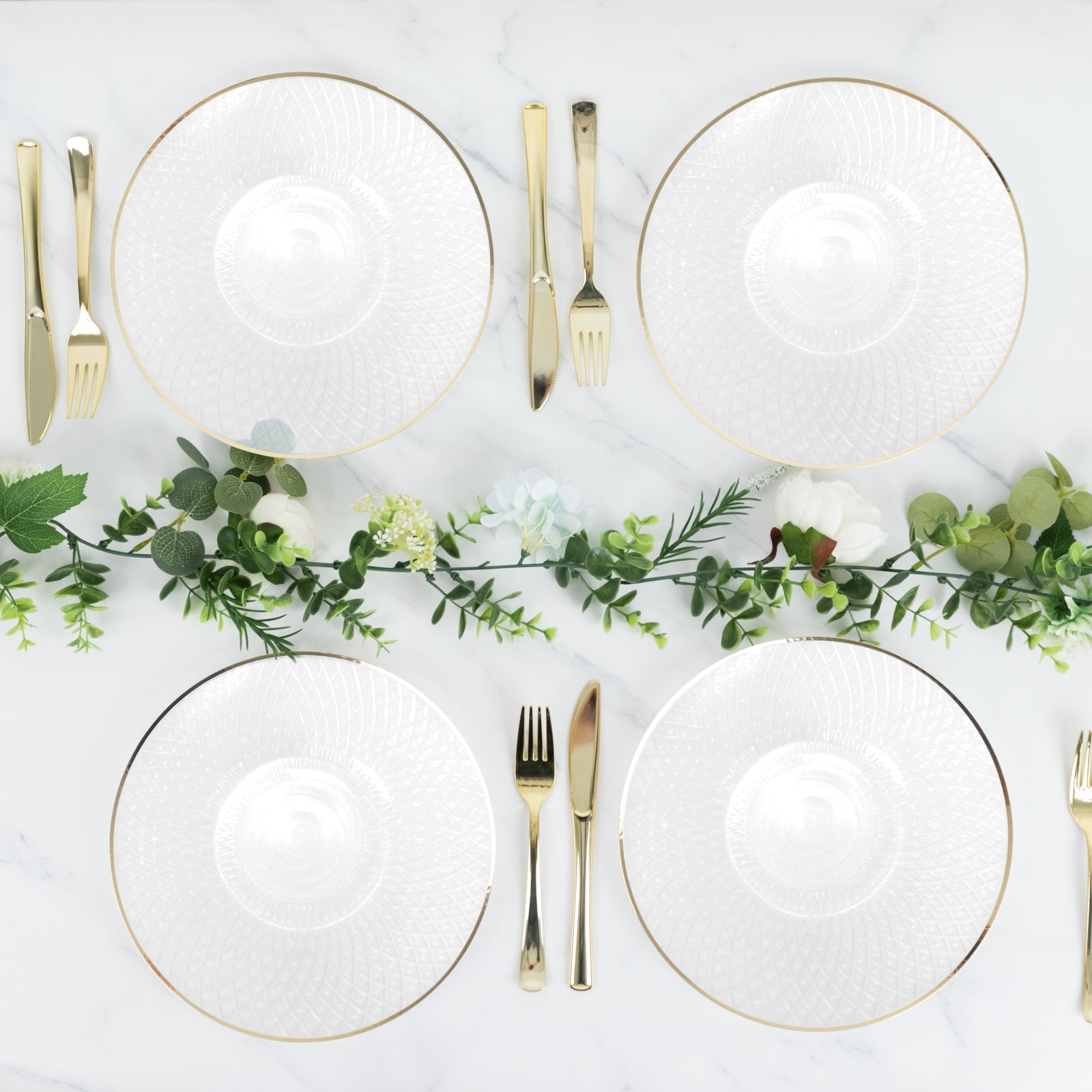 Pearl white disposable dinner plates with gold rims and diamond-cut pattern.