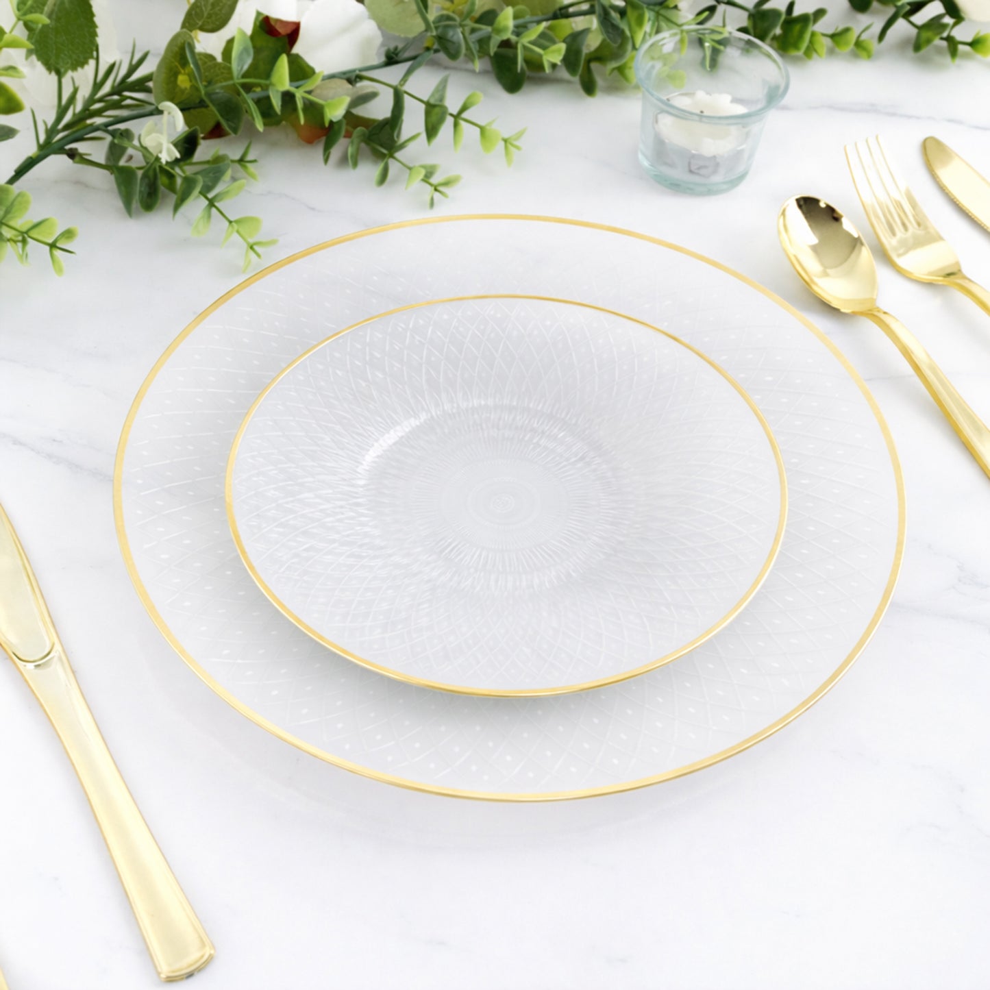 Pearl white plastic dessert plates with gold rim and radial diamond-cut pattern.