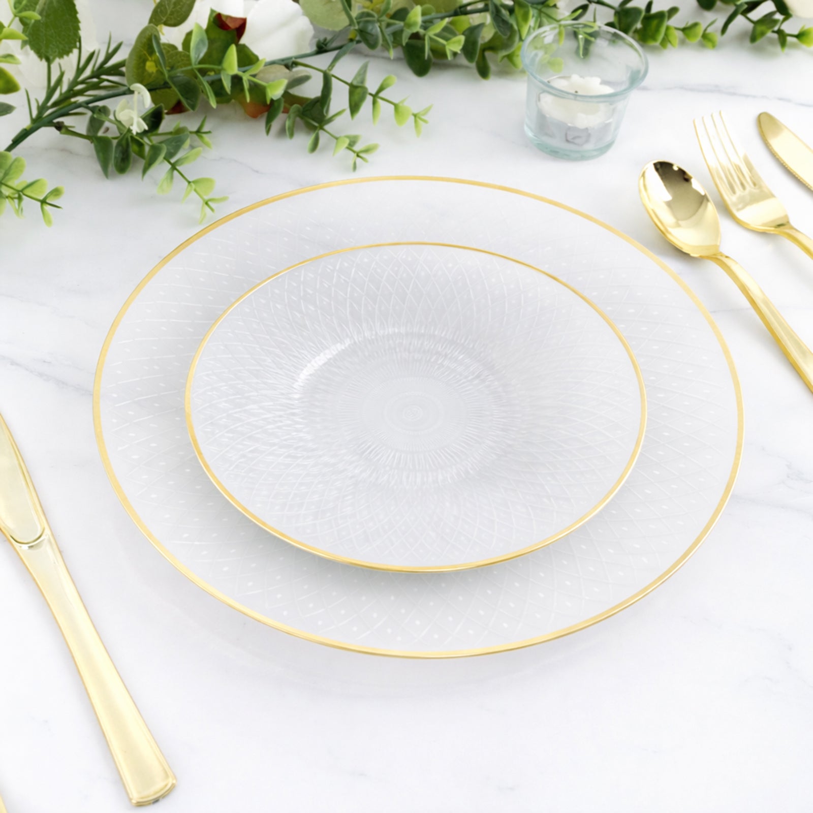 Pearl white plastic dessert plates with gold rim and radial diamond-cut pattern.